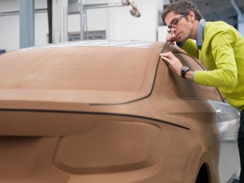 Christopher Weil and a clay model of the 2013 BMW 2 Series Coupe